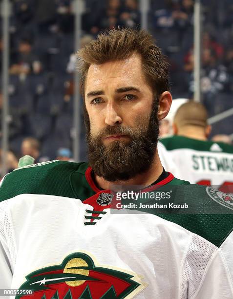 Kyle Quincey of the Minnesota Wild looks on during the pre-game warm up prior to NHL action against the Winnipeg Jets at the Bell MTS Place on...