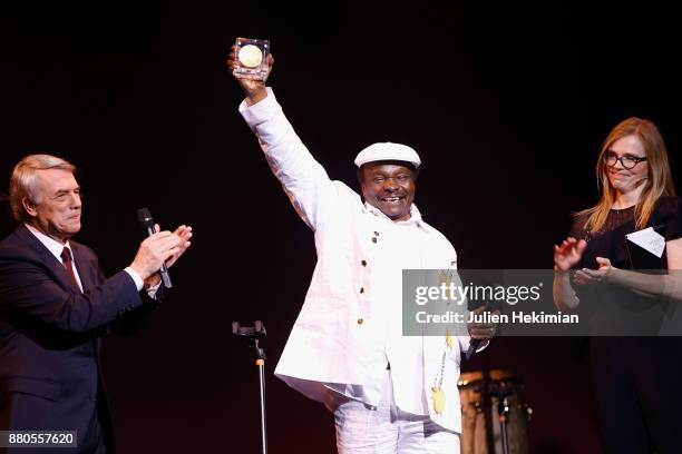 Guinean Singer Mory Kante is being awarded with the Great Prize of World Music by Salvatore Adamo and Isabelle Carre during les Grands Prix De La...