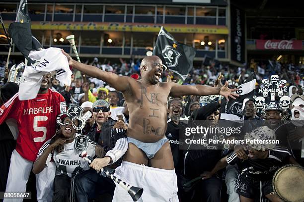 Supporters for the local team Orlando Pirates cheer as the team scores a goal on May 2, 2009 at Johannesburg Stadium, Johannesburg, South Africa....