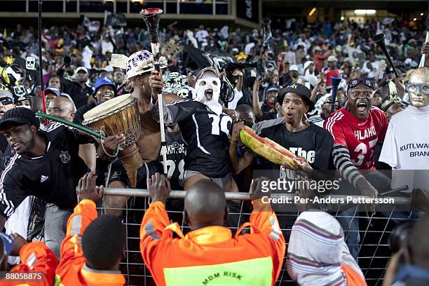 Supporters for the local team Orlando Pirates cheer as the team scores a goal on May 2, 2009 at Johannesburg Stadium, Johannesburg, South Africa....