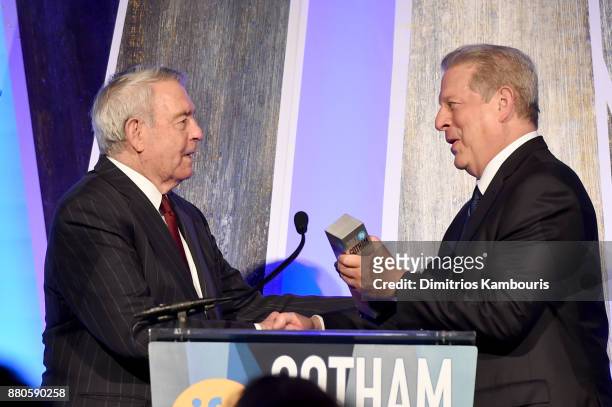 Journalist Dan Rather presents Former Vice President Al Gore with an award onstage during IFP's 27th Annual Gotham Independent Film Awards on...