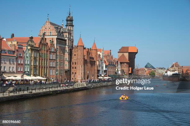 pleasure boat on motlawa river canal with old town buildings, gdansk, pomerania, poland - santa maria fotografías e imágenes de stock