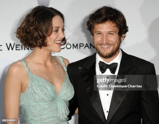 Actress Marion Cotillard and actor Guillaume Canet attend the amfAR Cinema Against AIDS 2009 benefit at the Hotel du Cap during the 62nd Annual...