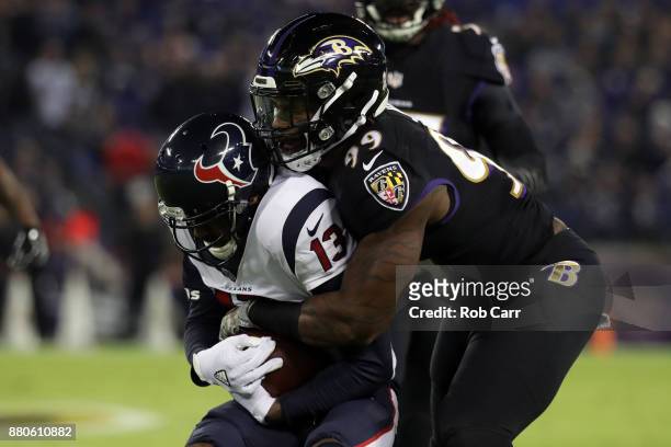 Wide Receiver Braxton Miller of the Houston Texans is tackled by outside linebacker Matt Judon of the Baltimore Ravens in the first quarter at M&T...