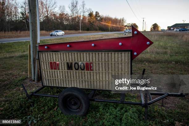 Campaigns signs for Judge Roy Moore line the road in before a campaign rally on November 27, 2017 in Henagar, Alabama. Over 100 people turned out to...