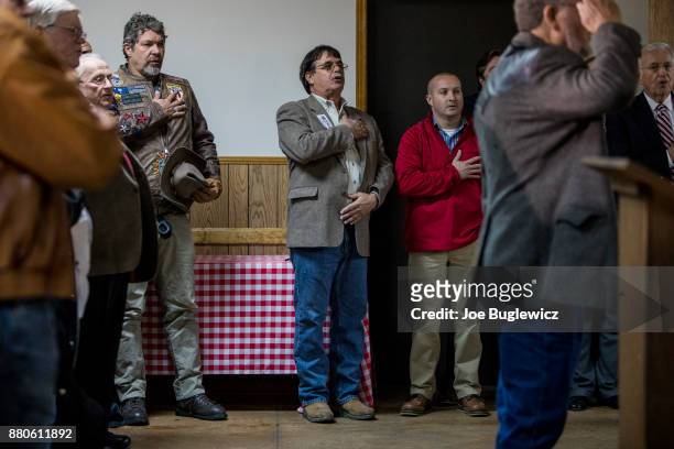Judge Roy Moore supporters say The Pledge of Allegiance during a campaign rally on November 27, 2017 in Henagar, Alabama. Over 100 people turned out...
