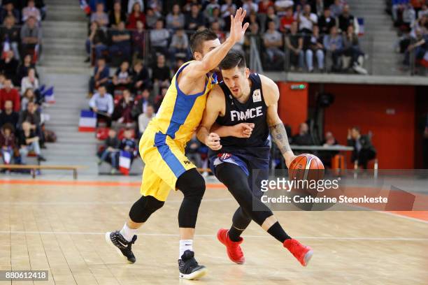 Paul Lacombe of France is trying to get to the basket against Nemanja Gordic of Bosnia and Herzegovina during the FIBA World Cup 2019 European...