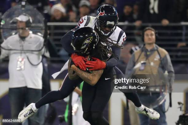 Wide Receiver Chris Moore of the Baltimore Ravens catches a pass in the second quarter against the Houston Texans at M&T Bank Stadium on November 27,...
