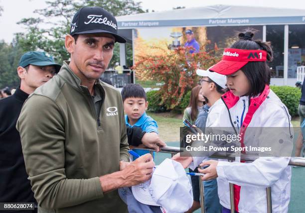 Rafa Cabrera Bello of Spain signs autograph for the golf fansduring round three of the UBS Hong Kong Open at The Hong Kong Golf Club on November 25,...