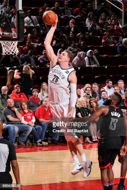 Timofey Mozgov of the Brooklyn Nets dunks the ball against the Houston Rockets on November 27, 2017 at the Toyota Center in Houston, Texas. NOTE TO...