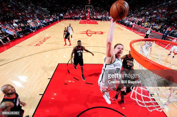 Timofey Mozgov of the Brooklyn Nets dunks the ball against the Houston Rockets on November 27, 2017 at the Toyota Center in Houston, Texas. NOTE TO...
