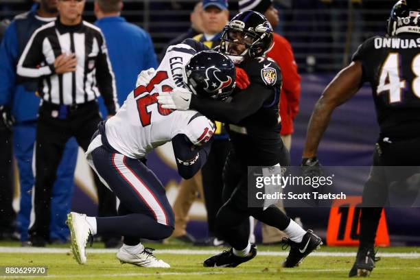 Wide Receiver Bruce Ellington of the Houston Texans is tackled by free safety Eric Weddle of the Baltimore Ravens in the second quarter at M&T Bank...