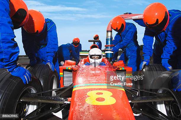 racecar driver at the pit stop - pitstop team stock pictures, royalty-free photos & images