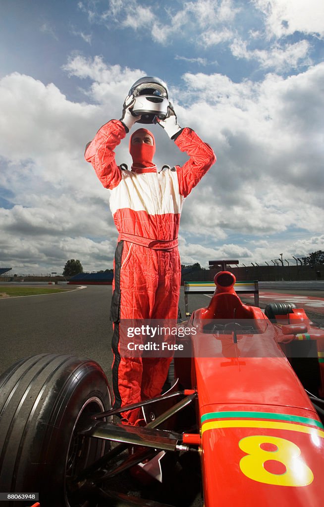 Racecar Driver Taking Off Helmet