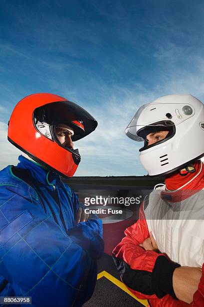 racecar drivers standing face to face - will power race car driver stock pictures, royalty-free photos & images