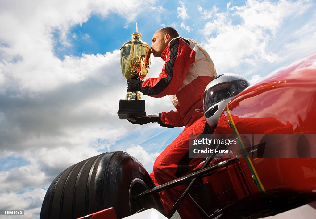 Racecar Driver Kissing Trophy