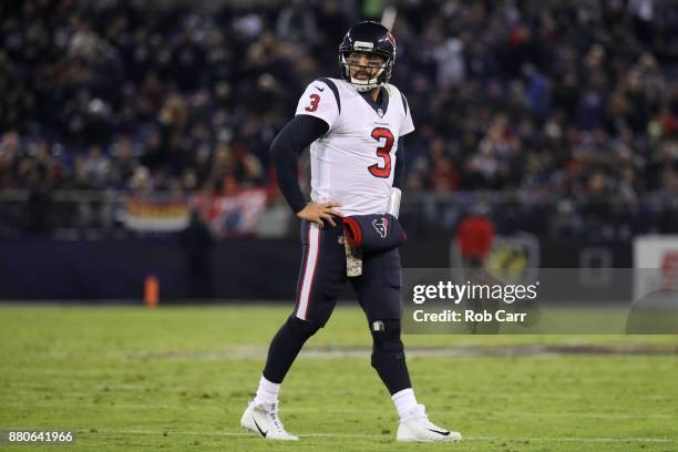 Quarterback Tom Savage of the Houston Texans walks off the field in the second quarter against the Baltimore Ravens at M&T Bank Stadium on November...