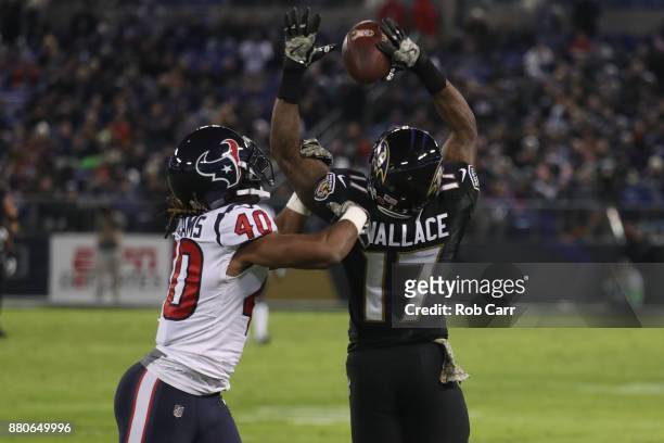 Cornerback Marcus Williams of the Houston Texans breaks up a pass to wide receiver Mike Wallace of the Baltimore Ravens in the third quarter at M&T...