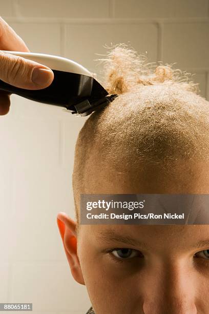child getting a buzz cut - teenage boy shave imagens e fotografias de stock