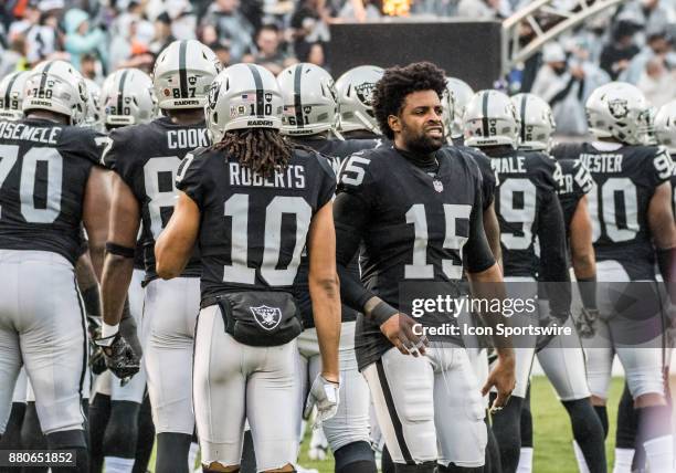 Oakland Raiders wide receiver Michael Crabtree stares at the Denver Broncos bench area before the game between the Denver Broncos verses the Oakland...