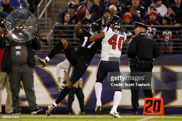 Cornerback Marcus Williams of the Houston Texans breaks up a pass to wide receiver Mike Wallace of the Baltimore Ravens in the third quarter at M&T...