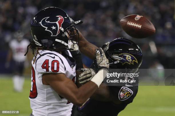 Cornerback Marcus Williams of the Houston Texans breaks up a pass to wide receiver Mike Wallace of the Baltimore Ravens in the third quarter at M&T...