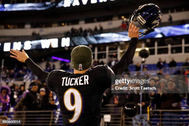 Kicker Justin Tucker of the Baltimore Ravens waves to fans after the Ravens win 23-16 over the Houston Texans at M&T Bank Stadium on November 27,...