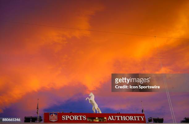 Brilliant blue and orange sunset over the south end zone during a game against the Cincinnati Bengals at Sports Authority Field at Mile High in...
