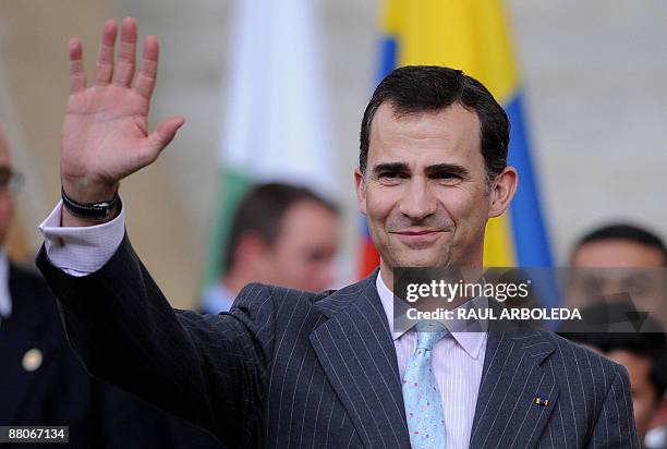Spain's Crown Prince Felipe de Borbon waves at people during a walk around Santo Domingo Savio neighborhood in Medellin, Antioquia department, on May...