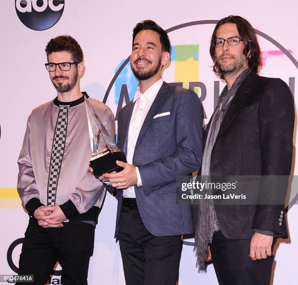 Brad Delson, Mike Shinoda and Rob Bourdon of Linkin Park pose in the press room at the 2017 American Music Awards at Microsoft Theater on November...