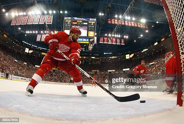 Brett Lebda of the Detroit Red Wings clears the puck out of the crease against the Chicago Blackhawks during Game Five of the Western Conference...