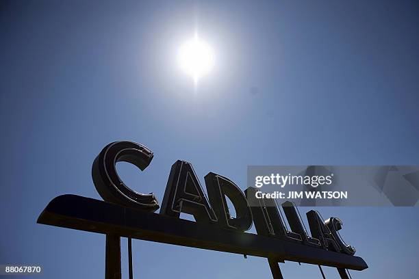 This April 5, 2009 file photo shows a Cadillac sign at a closed dealership in Easton, Maryland. General Motors, readying a massive bankruptcy filing...