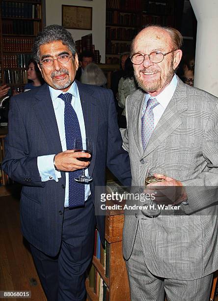 Publisher and editor-in-chief of Alfred A. Knopf, Ajai Singh "Sonny" Mehta, and The Strand Bookstore owner Fred Bass attend a cocktail reception with...
