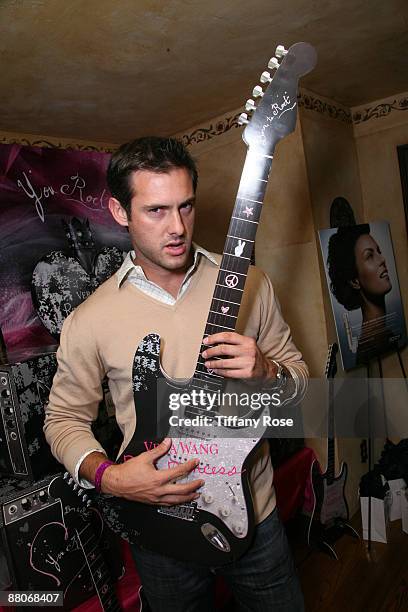 Actor Juan Barbieri rocks out on a Vera Wang rock princess guitar at Melanie Segal's MTV Movie Awards House Presented by Rev 3 - Day 2 on May 29,...