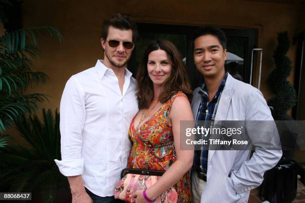 Actor Eric Mabius, Ivy Mabius with a Rafe purse, and bag designer Rafe Totengco attend Melanie Segal's MTV Movie Awards House Presented by Rev 3 -...