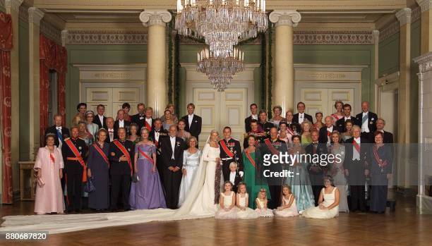 The official picture of the newlyweds and their families in the Royal Castle in Oslo late 25 August 2001. Back row from left: Kristin Hoeiby Bjornoy,...