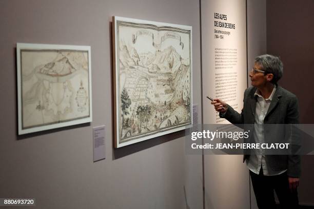 Guide gives explanations during a visit of the exhibition "Les Alpes de Jean de Beins - Des cartes aux paysages " at the Ancien Eveche museum on...