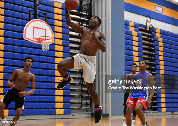 Gaithersburg freshman basketball player Jao Ituka takes a shot during practice on November 21, 2017 in Gaithersburg, Md.