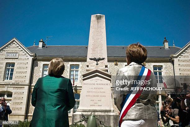 French mayor of the eastern town of Chassagne-Montrachet, Francoise Moreau and Chilean president Michelle Bachelet stand in front of a war memorial...