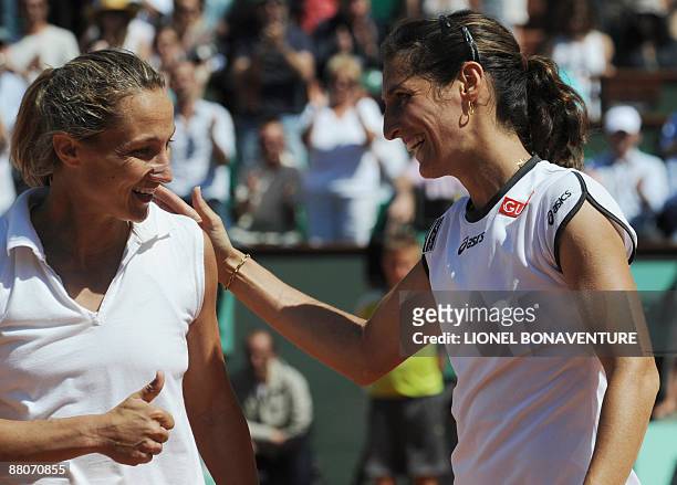 France's Virginie Razzano get's the thumbs up after winning against Italy's Tathiana Garbin during their French Open tennis third round match on May...