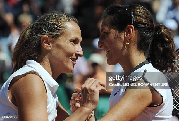 France's Virginie Razzano celebrates after winning against Italy's Tathiana Garbin during their French Open tennis third round match on May 30, 2009...