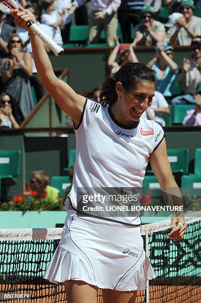 France's Virginie Razzano celebrates after winning against Italy's Tathiana Garbin during their French Open tennis third round match on May 30, 2009...