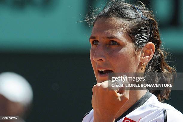 France's Virginie Razzano celebrates after winning against Italy's Tathiana Garbin during their French Open tennis third round match on May 30, 2009...