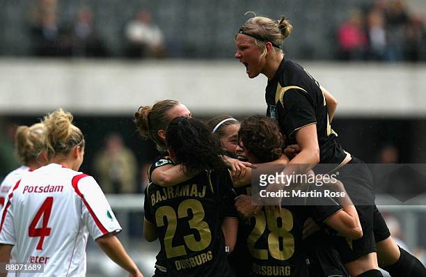 Simone Laudher of Duisburg celebrates with her team mates her team's 4 th goal during the Women's DFB Cup Final match between FCR Duisburg and...
