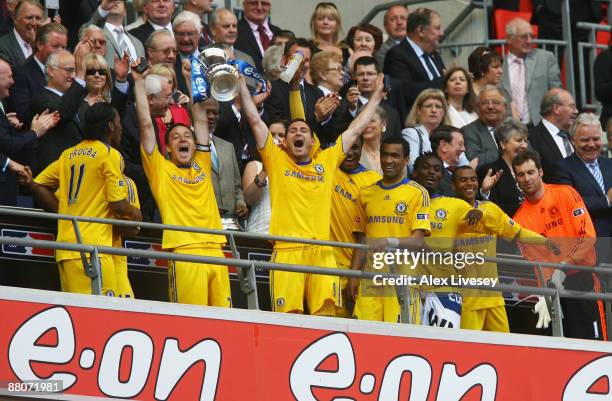 Captain John Terry of Chelsea lifts the trophy with Frank Lampard following victory during the FA Cup sponsored by E.ON Final match between Chelsea...