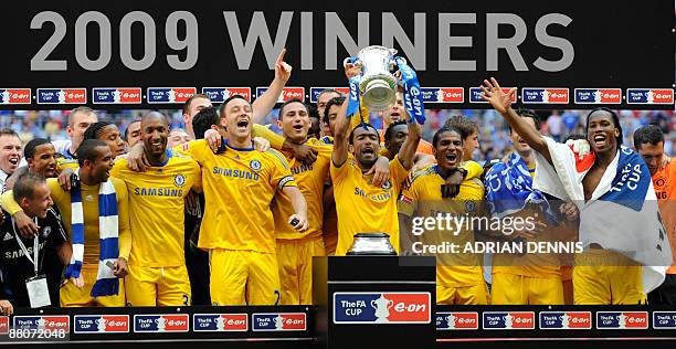 Chelsea footballers celebrate with the FA Cup after beating Everton 2-1 in the final at Wembley, in north London,on May 30, 2009. AFP PHOTO/ADRIAN...