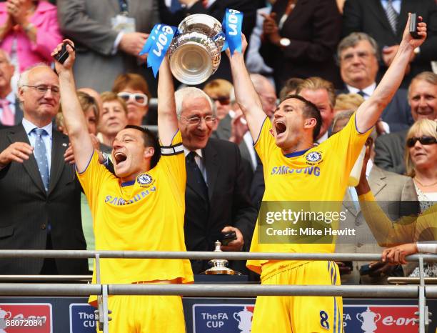 Captain John Terry of Chelsea lifts the trophy with Frank Lampard following victory during the FA Cup sponsored by E.ON Final match between Chelsea...