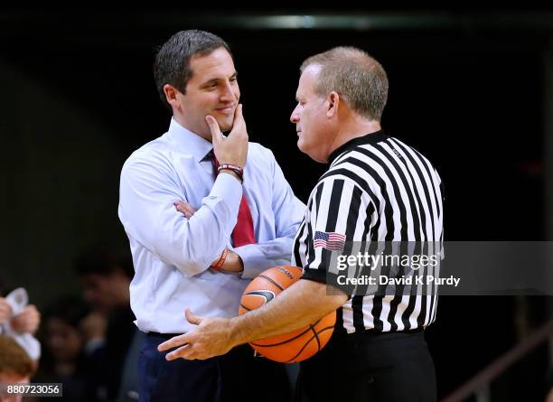 Head coach Steve Prohm of the Iowa State Cyclones shares a laugh with a referee during a time out in the first half of play against the Western...