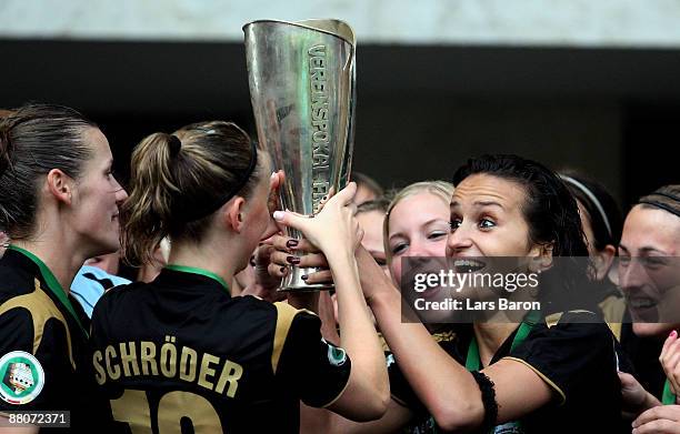 Fatmire Bajramaj of Duisburg holds the trophy after winning the DFB Women's Cup Final match between FCR Duisburg and Turbine Potsdam at the Olympic...