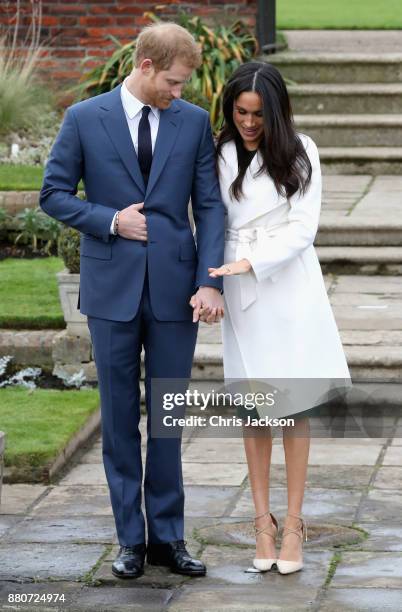 Prince Harry and Meghan Markle during an official photocall to announce the engagement of Prince Harry and actress Meghan Markle at The Sunken...